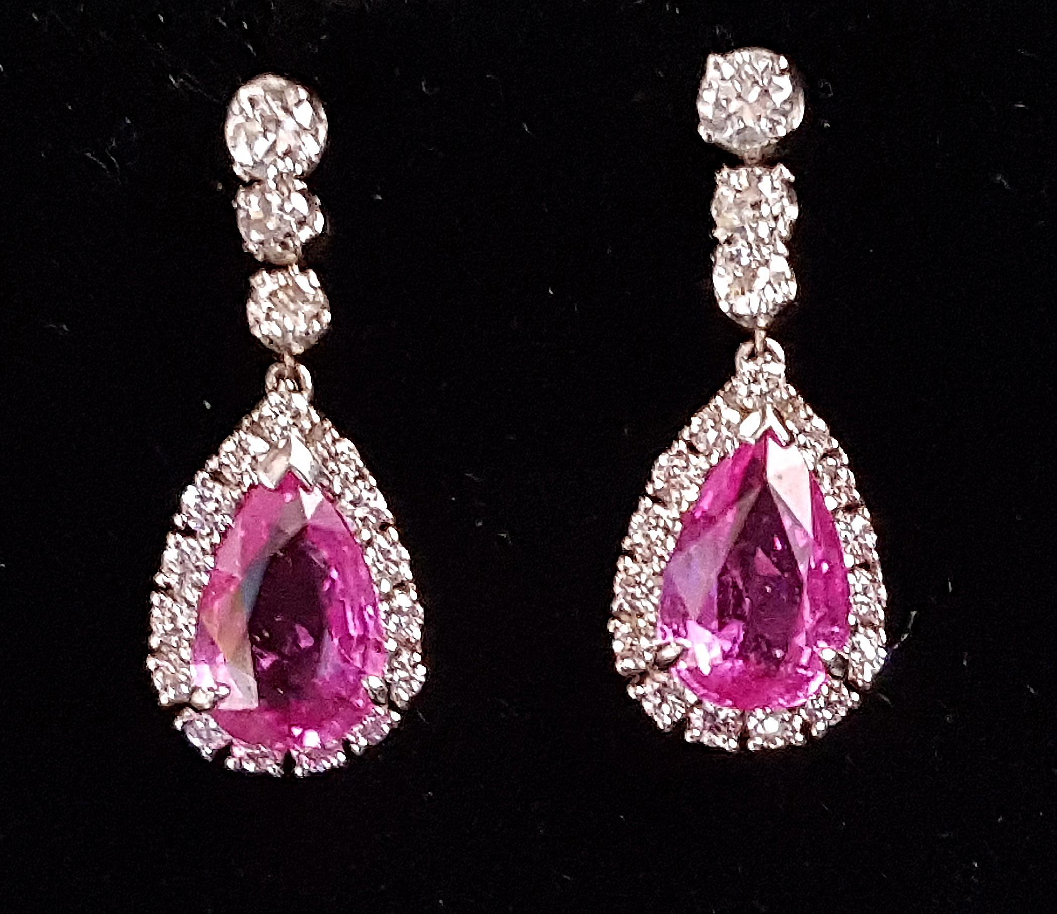 PAIR OF PINK TOPAZ AND DIAMOND DROP EARRINGS the central pear cut pink topaz on each approximately