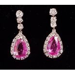 PAIR OF PINK TOPAZ AND DIAMOND DROP EARRINGS the central pear cut pink topaz on each approximately