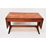 MCINTOSH TEAK OCCASIONAL TABLE with an oblong top with drop flaps above two frieze drawers, standing