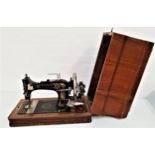 VINTAGE GERMAN SOWITCH SEWING MACHINE with manual operation, gilt holly decoration, serial number