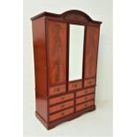CAXTON MAHOGANY WARDROBE with an arched top above a central mirror door flanked by a pair of