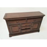 STAINED TEAK SIDE CABINET with a moulded top above two panelled frieze drawers, with three short