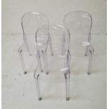 SET OF SIX CLEAR PLASTIC DINING CHAIRS with arched backs above shaped seats, standing on shaped