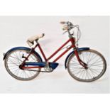 RALEIGH RODEO GIRLS BICYCLE with a red tubular frame, blue mud and chain guard