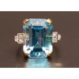 BLUE TOPAZ AND DIAMOND COCKTAIL RING the large emerald cut blue topaz measuring approximately 15.4mm