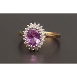 ALEXANDRITE AND DIAMOND CLUSTER RING the central oval cut alexandrite approximately 1.1cts in twenty