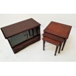 MAHOGANY AND CROSSBANDED NEST OF TABLES with square tops, standing on reeded tapering supports, 45.