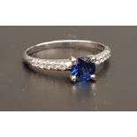SAPPHIRE AND DIAMOND RING the central round cut sapphire approximately 0.5cts flanked by diamond set