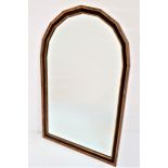 MAHOGANY AND GILT WALL MIRROR with an arched frame and an arched bevelled plate, 65cm high