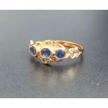 SAPPHIRE THREE STONE RING on nine carat gold shank with decorative pierced setting, ring size M