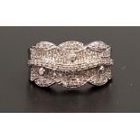 DIAMOND SET DRESS RING the multi diamonds in shaped setting with central raised wavy line of