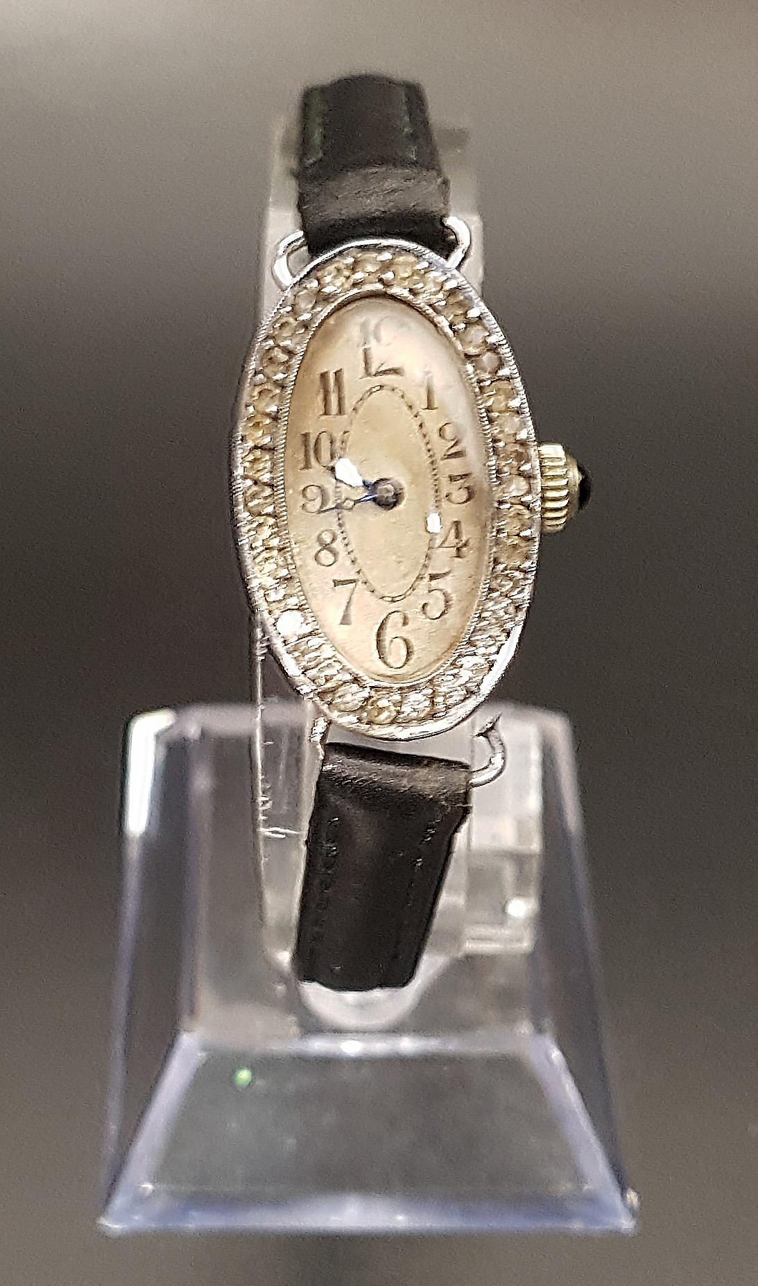 1920s LADIES SILVER CASED COCKTAIL WATCH Swiss made, the case front with stone set surround, with