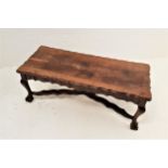 TEAK OCCASIONAL TABLE the oblong top with a wavy edge and frieze, standing on cabriole supports with