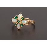 UNUSUAL OPAL AND EMERALD CLUSTER RING the four oval cabochon opals separated by round cut