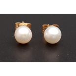 PAIR OF PEARL STUD EARRINGS the pearls approximately 5.5mm diameter, in nine carat gold