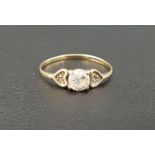 CLEAR GEM SET DRESS RING the central gemstone flanked by textured hearts, on nine carat gold