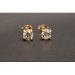 PAIR OF DIAMOND SOLITAIRE EARRINGS the round brilliant cut diamonds totaling approximately 0.9cts,