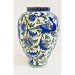 IZNIK STYLE POTTERY VASE possibly late 19th century, the off white ground decorated with birds among