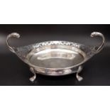 GEORGE V SILVER BON BON DISH of circular form with a pierced rim and a pair of scroll lion mask