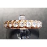 CLEAR GEM SET ETERNITY RING in nine carat gold, ring size L