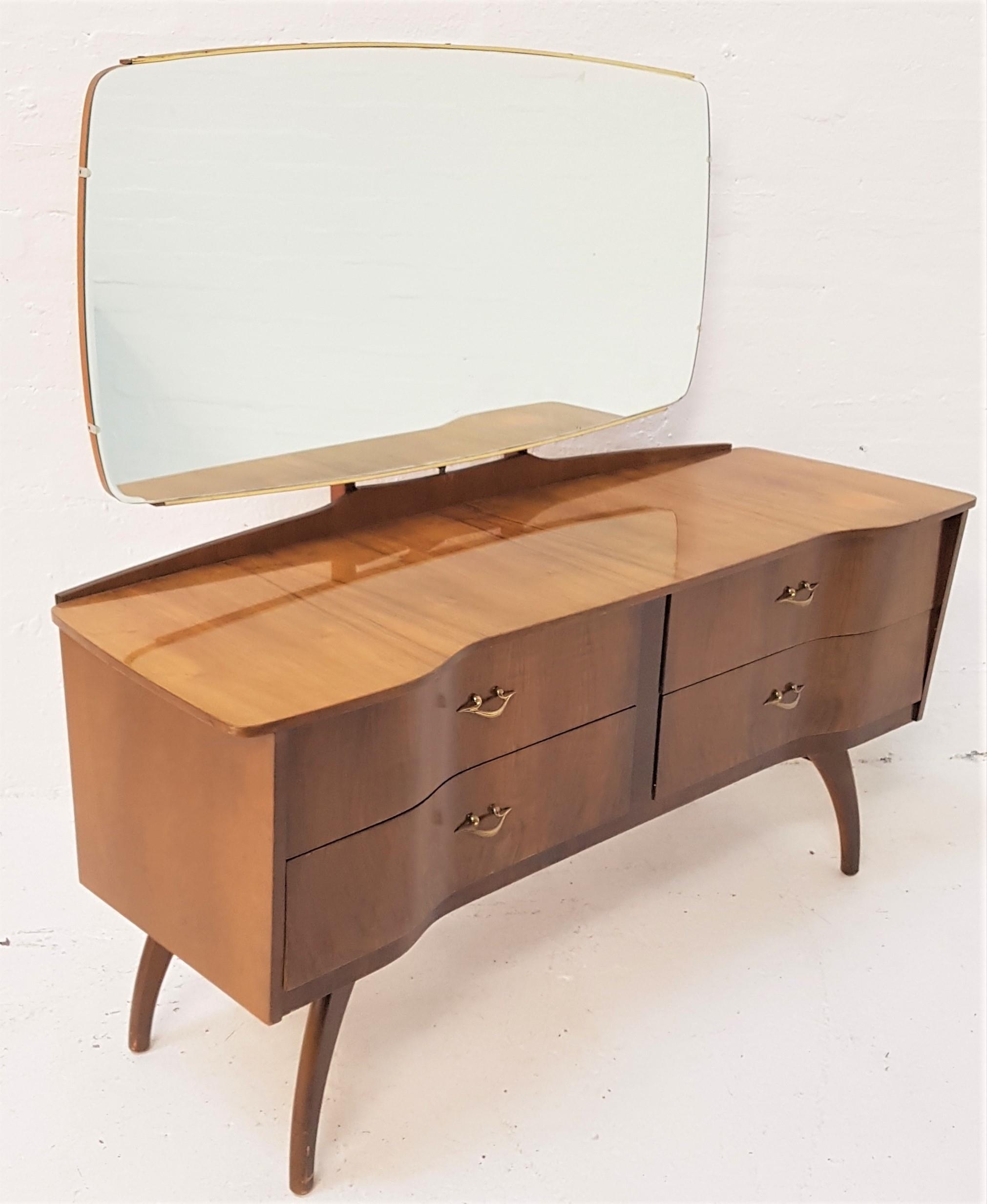 RETRO WALNUT DRESSING CHEST with a shaped mirror back above an inverted breakfront with four