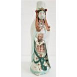 LARGE JAPANESE PORCELAIN FIGURE OF KANNON dressed in flowing robes and holding a scroll in both