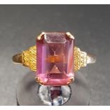 PINK GEM SET SINGLE STONE RING on nine carat gold shank with stepped shoulders, ring size P