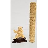 CHINESE CARVED IVORY NEEDLE CASE of cylindrical form with a screw lid, the body and lid depicting