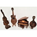 FOUR CONTINENTAL TEAK MUSIC BOXES modelled as a grand piano with an opening lid and stool, 21.5cm