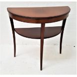 LEGATE MAHOGANY D SHAPED SIDE TABLE with a moulded top above a shaped lower shelf, standing on three
