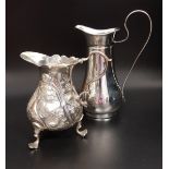 GEORGE III SILVER CREAM JUG raised on three scroll feet, the body with a cartouche and floral