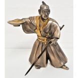 JAPANESE STAINLESS STEEL FIGURE OF A SAMURAI wearing a kimono and holding a bowl in his raised right