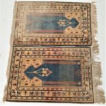 PAIR OF TURKISH PRAYER RUGS centered with a blue ground with a pair of columns and a decorative