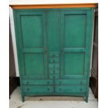 GREEN STAINED WARDROBE with a moulded top above three central drawers flanked by a pair of