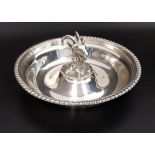 GEORGE V SILVER TRINKET DISH of circular form with a beaded rim and centered with a goats head,