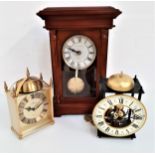 LONDON CLOCK COMPANY MANTLE CLOCK in a mahogany case with a circular dial with Roman numerals and