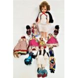 SELECTION OF WORLD DOLLS some with porcelain heads and in traditional dress, with examples from