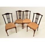 SET OF FOUR GEORGE VI DINING CHAIRS with shaped top rails above four central pierced splats, with