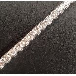 DIAMOND AND EIGHTEEN CARAT WHITE GOLD LINE BRACELET the diamonds totaling approximately 2.75cts,
