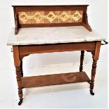 EDWARDIAN WASHSTAND with a raised tiled back above a grey marble top with side mounted brass hooks