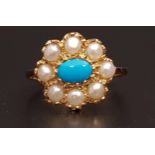 TURQUOISE AND PEARL CLUSTER RING the central oval cabochon turquoise stone in eight pearl
