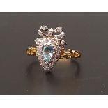 UNUSUAL BLUE TOPAZ AND DIAMOND CLUSTER RING the pear cut topaz in diamond surround and surmounted by