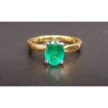 EMERALD SINGLE STONE RING the oval cut emerald approximately 1.2cts, on eighteen carat gold shank,