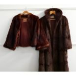 LADIES FULL LENGTH MINK COAT with a retailers label for Meg Buchanan, Falkirk, with embroidered V.