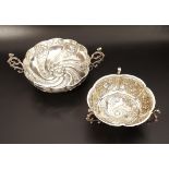 VICTORIAN SILVER BON-BON DISH of circular lobed form with embossed panels, raised on shaped scroll