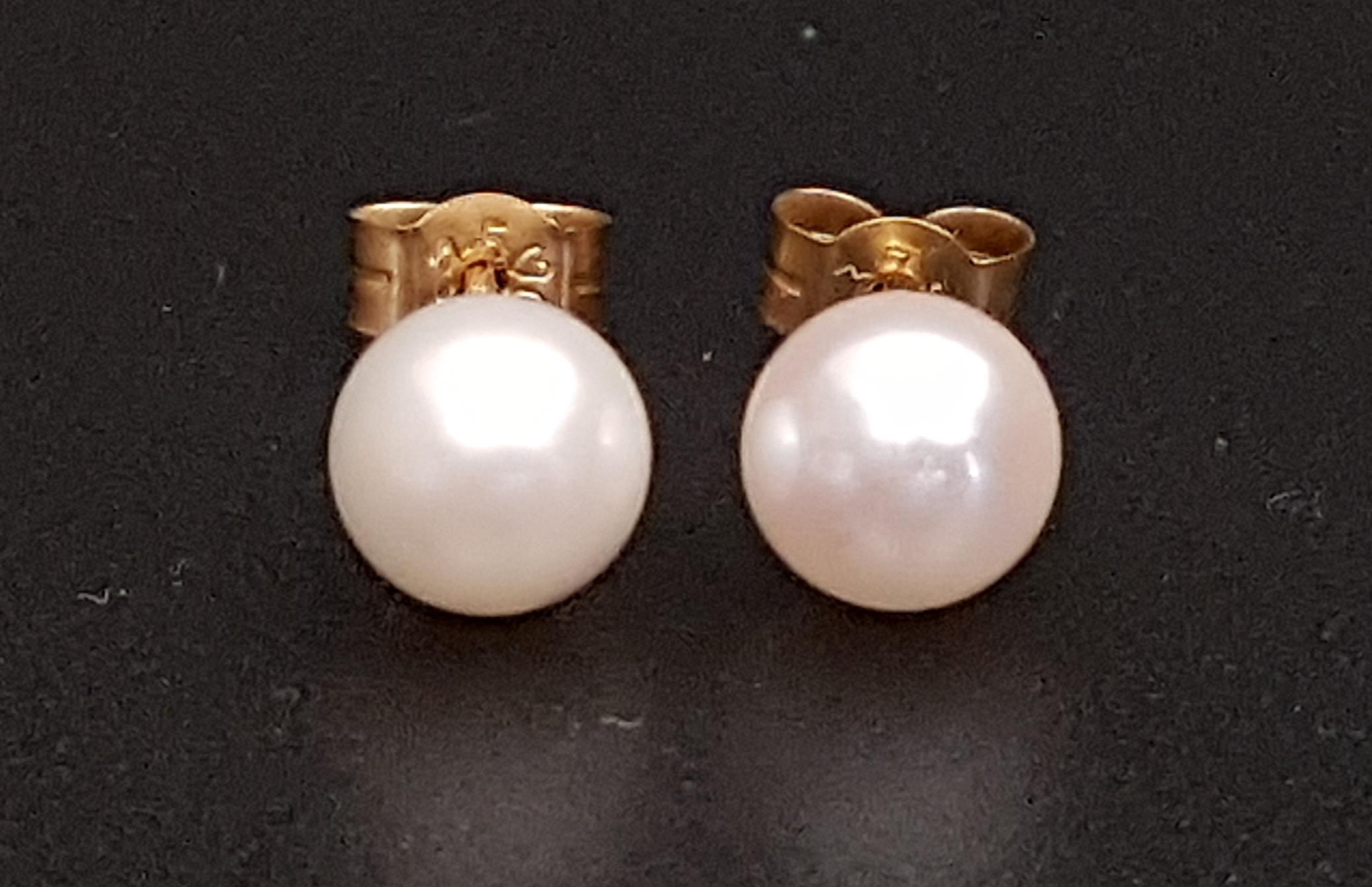 PAIR OF PEARL STUD EARRINGS the pearls approximately 6.2mm diameter, in nine carat gold