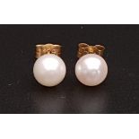 PAIR OF PEARL STUD EARRINGS the pearls approximately 6.2mm diameter, in nine carat gold