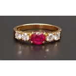 RUBY AND DIAMOND FIVE STONE RING the central oval cut treated ruby approximately 1ct flanked by