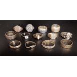 THIRTEEN SILVER RINGS of various designs including a German 1914 Vaterlands Dank ring, a Thai
