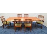 MCINTOSH TEAK EXTENDING DINING TABLE AND SIX CHAIRS the table with a pull apart top revealing two